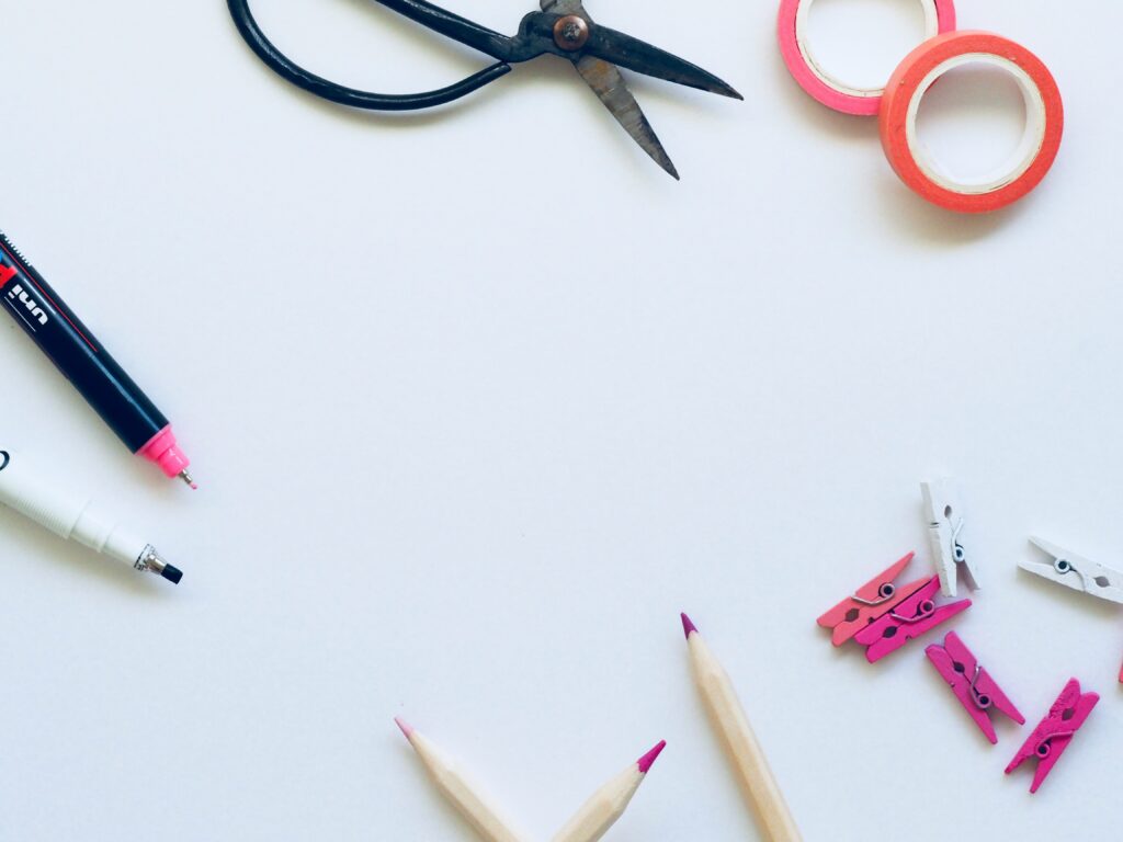 Creative desk with stationery and production tools